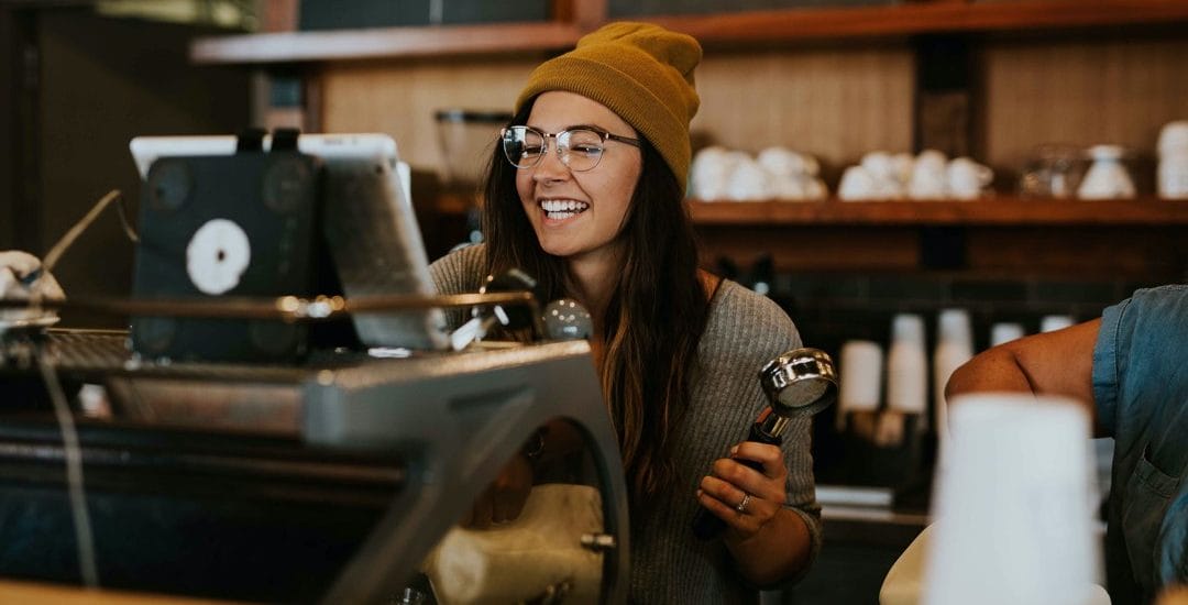 Restaurant or Coffee Shop with happy barista server with customers