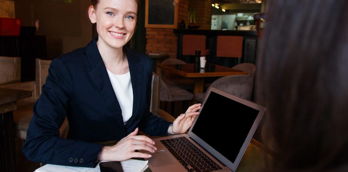 smiling woman working on computer