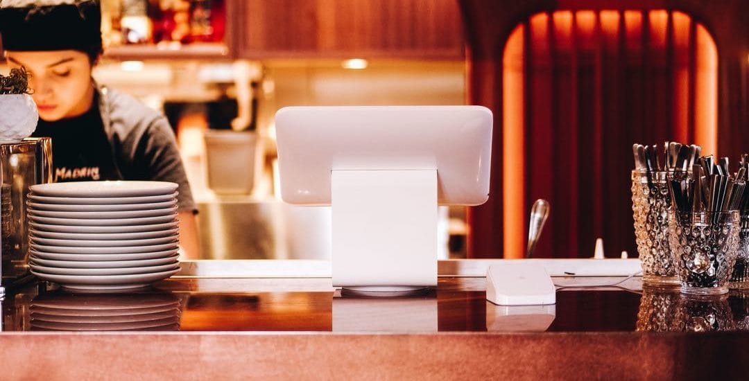 Restaurant or Coffee Shop with happy barista server with pastries, cake and customers